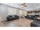 Open-concept living room featuring tile floors, recessed lights, and an adjacent kitchen at 7761 Boyd Ave, Las Vegas, NV 89179