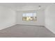 Light and airy bedroom with a window and neutral carpet at 8043 Texas Hills St, Las Vegas, NV 89113
