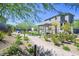 A beautiful community area with green grass, walking path and sitting area for residents to enjoy at 8043 Texas Hills St, Las Vegas, NV 89113