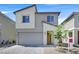 Charming two-story home featuring a modern design, two-car garage and desert landscaping at 8043 Texas Hills St, Las Vegas, NV 89113