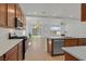 Modern kitchen featuring stainless steel appliances, warm wood cabinets, and recessed lighting at 8043 Texas Hills St, Las Vegas, NV 89113