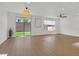 Bright living space with wood-look floors and backyard views through sliding glass doors at 8043 Texas Hills St, Las Vegas, NV 89113