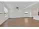 Open living space featuring recessed lighting, wood-look flooring and large windows for natural light at 8043 Texas Hills St, Las Vegas, NV 89113