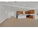 Open-concept living space with wood-look flooring, recessed lighting, and a modern kitchen at 8043 Texas Hills St, Las Vegas, NV 89113