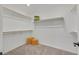 Walk-in closet includes rods for hanging clothes and carpeted flooring at 8043 Texas Hills St, Las Vegas, NV 89113