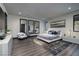 Modern bedroom featuring a plush bed, elegant decor, and ample natural light at 811 Magnum Cliff Ct, Henderson, NV 89012