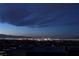 Expansive Las Vegas city views at night with skyline and mountains in the distance at 811 Magnum Cliff Ct, Henderson, NV 89012