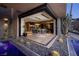 Stunning outdoor dining area with easy access to the pool and outdoor living space, complete with a wine cellar at 811 Magnum Cliff Ct, Henderson, NV 89012