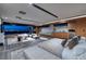 Open main bedroom with sitting area, kitchenette, and panoramic views of the city skyline at 811 Magnum Cliff Ct, Henderson, NV 89012
