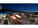 Luxury outdoor space with fire pit, lounge seating, and panoramic views of the city lights at 811 Magnum Cliff Ct, Henderson, NV 89012