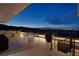 Inviting outdoor patio with dining area, comfortable seating, and panoramic city views at 811 Magnum Cliff Ct, Henderson, NV 89012