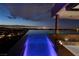 Spectacular infinity pool with panoramic city views, blending luxury and breathtaking scenery for ultimate relaxation at 811 Magnum Cliff Ct, Henderson, NV 89012