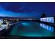 Modern pool with city views and outdoor entertainment area featuring a tv at 811 Magnum Cliff Ct, Henderson, NV 89012