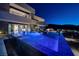 Luxurious home featuring an infinity pool with views, modern design, and seamless indoor-outdoor living at 811 Magnum Cliff Ct, Henderson, NV 89012