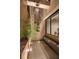 Private outdoor shower with rain head, tiled floor, and lush greenery at 811 Magnum Cliff Ct, Henderson, NV 89012