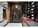 Climate-controlled wine cellar with custom storage, elegant lighting, and refined decor at 811 Magnum Cliff Ct, Henderson, NV 89012