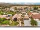 Expansive home with a three-car garage, spacious driveway, well-manicured lawn, backyard pool and desert landscaping at 8216 Tursi Lodge Ct, Las Vegas, NV 89131