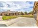 Expansive backyard featuring lush green lawn, mature landscaping, and covered patio areas, offering plenty of space at 8216 Tursi Lodge Ct, Las Vegas, NV 89131