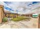 Large backyard with a covered patio, outdoor bar, oversized garage, and RV parking, ideal for entertaining at 8216 Tursi Lodge Ct, Las Vegas, NV 89131