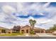 Charming single-story home featuring desert landscaping, a three-car garage, and a stone facade at 8216 Tursi Lodge Ct, Las Vegas, NV 89131