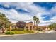 Charming single-story home with desert landscaping and a stone facade, featuring an attached three-car garage at 8216 Tursi Lodge Ct, Las Vegas, NV 89131