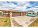 Oversized garage with ample parking space, plus a vintage RV, perfect for car enthusiasts and outdoor adventurers at 8216 Tursi Lodge Ct, Las Vegas, NV 89131