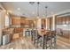 Open kitchen with stainless appliances, granite countertops, and a large center island with seating at 8216 Tursi Lodge Ct, Las Vegas, NV 89131