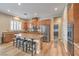 Spacious kitchen with granite countertops, stainless steel appliances, and wood-look flooring at 8216 Tursi Lodge Ct, Las Vegas, NV 89131
