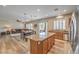Open floor plan featuring kitchen with stainless steel appliances, living room and dining area at 8216 Tursi Lodge Ct, Las Vegas, NV 89131