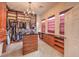 Walk-in closet with custom shelving and cabinets, offering ample storage space at 8216 Tursi Lodge Ct, Las Vegas, NV 89131