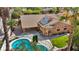 Aerial view of property with private pool and solar panels at 8216 W Hammer Ln, Las Vegas, NV 89149