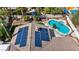 Aerial view showcases solar panels and a backyard oasis with a pool and spa at 8216 W Hammer Ln, Las Vegas, NV 89149