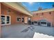 Inviting covered patio with outdoor kitchen near the pool, perfect for entertaining and outdoor living at 8216 W Hammer Ln, Las Vegas, NV 89149