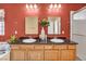 Bathroom featuring a double vanity with granite countertops, dual sinks, and modern fixtures at 8216 W Hammer Ln, Las Vegas, NV 89149