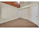 Bedroom with neutral carpeting and walls, ceiling fan, and door to other rooms at 8216 W Hammer Ln, Las Vegas, NV 89149