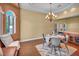 This dining room features a breakfast nook, chandelier, and serving counter at 8216 W Hammer Ln, Las Vegas, NV 89149