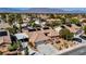 Aerial view of a charming home with solar panels, well-manicured landscaping and mountain views at 8216 W Hammer Ln, Las Vegas, NV 89149