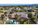 Charming aerial view of home with solar panels, a refreshing pool, lush palm trees, and desert landscaping at 8216 W Hammer Ln, Las Vegas, NV 89149
