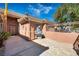 Elegant home entrance featuring a decorative gate and beautiful stucco exterior with angel statue at 8216 W Hammer Ln, Las Vegas, NV 89149
