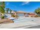Beautiful single story home with a well-maintained yard and three car garage at 8216 W Hammer Ln, Las Vegas, NV 89149