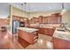 Gourmet kitchen with granite countertops, stainless steel appliances, and custom cabinetry at 8216 W Hammer Ln, Las Vegas, NV 89149