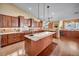 Kitchen with stone countertops, custom cabinetry, hardwood floors, and stainless appliances at 8216 W Hammer Ln, Las Vegas, NV 89149