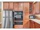 Modern kitchen features stainless steel appliances, tile backsplash, and custom cabinets at 8216 W Hammer Ln, Las Vegas, NV 89149
