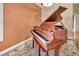 Cozy living room showcasing piano and area rug at 8216 W Hammer Ln, Las Vegas, NV 89149