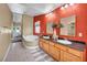 Bathroom featuring soaking tub, double sink vanity and tile floors with neutral colors at 8216 W Hammer Ln, Las Vegas, NV 89149