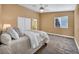 Cozy main bedroom featuring a ceiling fan and window with natural light at 8216 W Hammer Ln, Las Vegas, NV 89149