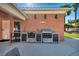 Covered outdoor kitchen boasting stainless steel appliances, a grill, and a sink at 8216 W Hammer Ln, Las Vegas, NV 89149