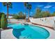 Inviting backyard pool and spa area surrounded by palm trees and well-maintained landscaping at 8216 W Hammer Ln, Las Vegas, NV 89149