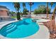 Inviting pool and spa with sunning deck surrounded by lush landscaping, ideal for relaxation and enjoyment at 8216 W Hammer Ln, Las Vegas, NV 89149