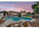 Beautiful backyard oasis with a sparkling pool and ample space for entertaining at 8216 W Hammer Ln, Las Vegas, NV 89149